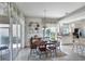 Charming dining area with wooden table and chairs, adjacent to kitchen at 13240 Guyana St, Venice, FL 34293