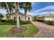 Beautiful home with a landscaped yard and brick paver driveway at 13240 Guyana St, Venice, FL 34293