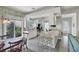 Well-equipped kitchen with white cabinets, stainless steel appliances, and breakfast bar at 13240 Guyana St, Venice, FL 34293