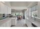 Modern kitchen with white cabinets and granite countertops at 13240 Guyana St, Venice, FL 34293