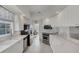 Clean lines and white cabinetry highlight this kitchen with stainless steel appliances at 13240 Guyana St, Venice, FL 34293