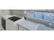 Laundry room with washer, dryer, and countertop at 13240 Guyana St, Venice, FL 34293