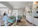 Spacious living room with light teal sofas and built-in shelves at 13240 Guyana St, Venice, FL 34293