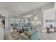 Spacious living room with light teal sofas at 13240 Guyana St, Venice, FL 34293