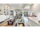 Bright living room with light teal sofa and built-in shelving at 13240 Guyana St, Venice, FL 34293