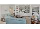 Bright living room features comfortable sofas, a coffee table, and built-in shelving at 13240 Guyana St, Venice, FL 34293