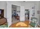 Sunlit office with hardwood floors, views to living areas, and built-in shelving at 13240 Guyana St, Venice, FL 34293