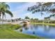 Picturesque waterway with a quaint bridge and lush landscaping at 13240 Guyana St, Venice, FL 34293
