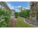 Landscaped backyard with lush greenery at 135 Braemar Ave, Venice, FL 34293