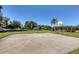 Community basketball court with playground nearby at 135 Braemar Ave, Venice, FL 34293