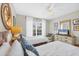 Bedroom with twin beds, nautical decor, and window at 135 Braemar Ave, Venice, FL 34293