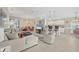 Spacious living room featuring a large sectional sofa and adjacent kitchen at 135 Braemar Ave, Venice, FL 34293