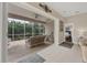 Living area with sliding glass doors that open to a relaxing patio at 135 Braemar Ave, Venice, FL 34293