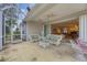 Screened porch with view of living room and backyard at 135 Braemar Ave, Venice, FL 34293