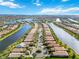 Aerial view of a community with houses and waterways at 13864 Posada St, Venice, FL 34293