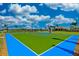 Outdoor basketball court with green and blue surface at 13864 Posada St, Venice, FL 34293