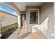 Front entry with arched walkway and decorative door at 13864 Posada St, Venice, FL 34293