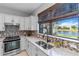 Bright kitchen with a water view and modern fixtures at 13864 Posada St, Venice, FL 34293