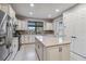 Spacious kitchen with stainless steel appliances and white cabinets at 13864 Posada St, Venice, FL 34293