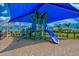 playground with shade structure and play equipment at 13864 Posada St, Venice, FL 34293