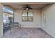 Screened porch with paver floor and ceiling fan at 13864 Posada St, Venice, FL 34293