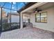 Screened porch with pavers and wicker bench at 13864 Posada St, Venice, FL 34293