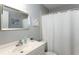 Clean bathroom with tub/shower combo, vanity, and white decor at 140 Columbia Rd, Venice, FL 34293