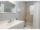 Bathroom with tub/shower combo and updated vanity at 140 Columbia Rd, Venice, FL 34293