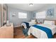 Guest bedroom with twin beds, wood floors, and calming decor at 140 Columbia Rd, Venice, FL 34293
