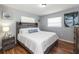 Bright bedroom with a king-size bed and wood-look floors at 140 Columbia Rd, Venice, FL 34293