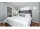 King bed, walk-in closet, and wood-look floors in this bedroom at 140 Columbia Rd, Venice, FL 34293