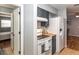 Recently updated kitchen with white appliances and dark blue cabinets at 140 Columbia Rd, Venice, FL 34293