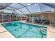 Relaxing screened-in pool with plenty of room for lounging at 140 Columbia Rd, Venice, FL 34293
