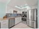 Modern kitchen with stainless steel appliances at 1423 Avenida Del Circo # 1C, Venice, FL 34285