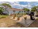Backyard patio with brick pavers, grill, and seating area at 1423 Avenida Del Circo # 1C, Venice, FL 34285