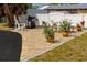 Outdoor patio with brick pavers, grill, and seating area at 1423 Avenida Del Circo # 1C, Venice, FL 34285