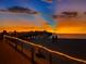Beach pier at sunset with string lights at 1423 Avenida Del Circo # 1C, Venice, FL 34285