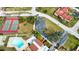 Aerial view showing tennis courts, pool, and community at 1437 57Th W St # 1437, Bradenton, FL 34209