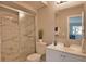 Clean bathroom with a marble shower, toilet, and vanity at 1437 57Th W St # 1437, Bradenton, FL 34209