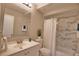 Updated bathroom with marble tile and a shower/tub combo at 1437 57Th W St # 1437, Bradenton, FL 34209