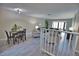 Bright dining area with modern furniture and grey wood-look flooring at 1437 57Th W St # 1437, Bradenton, FL 34209