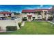 Two-story condo building with parking and landscaped grounds at 1437 57Th W St # 1437, Bradenton, FL 34209