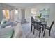 Open concept living room and dining area, featuring modern furniture at 1437 57Th W St # 1437, Bradenton, FL 34209