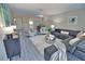 Bright living room featuring a sectional sofa and dining area at 1437 57Th W St # 1437, Bradenton, FL 34209