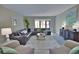 Spacious living room with comfortable seating and large windows at 1437 57Th W St # 1437, Bradenton, FL 34209