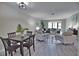 Open and airy living room with modern furniture and grey flooring at 1437 57Th W St # 1437, Bradenton, FL 34209