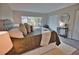 Main bedroom with king-size bed and large window at 1437 57Th W St # 1437, Bradenton, FL 34209