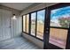 Bright sunroom featuring sliding glass doors leading to the patio at 1437 57Th W St # 1437, Bradenton, FL 34209