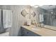 Bathroom with granite countertop, double sinks, and walk in shower at 1531 Placida Rd # 1-103, Englewood, FL 34223