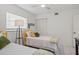Bright bedroom with twin beds, and yellow accents at 1531 Placida Rd # 1-103, Englewood, FL 34223